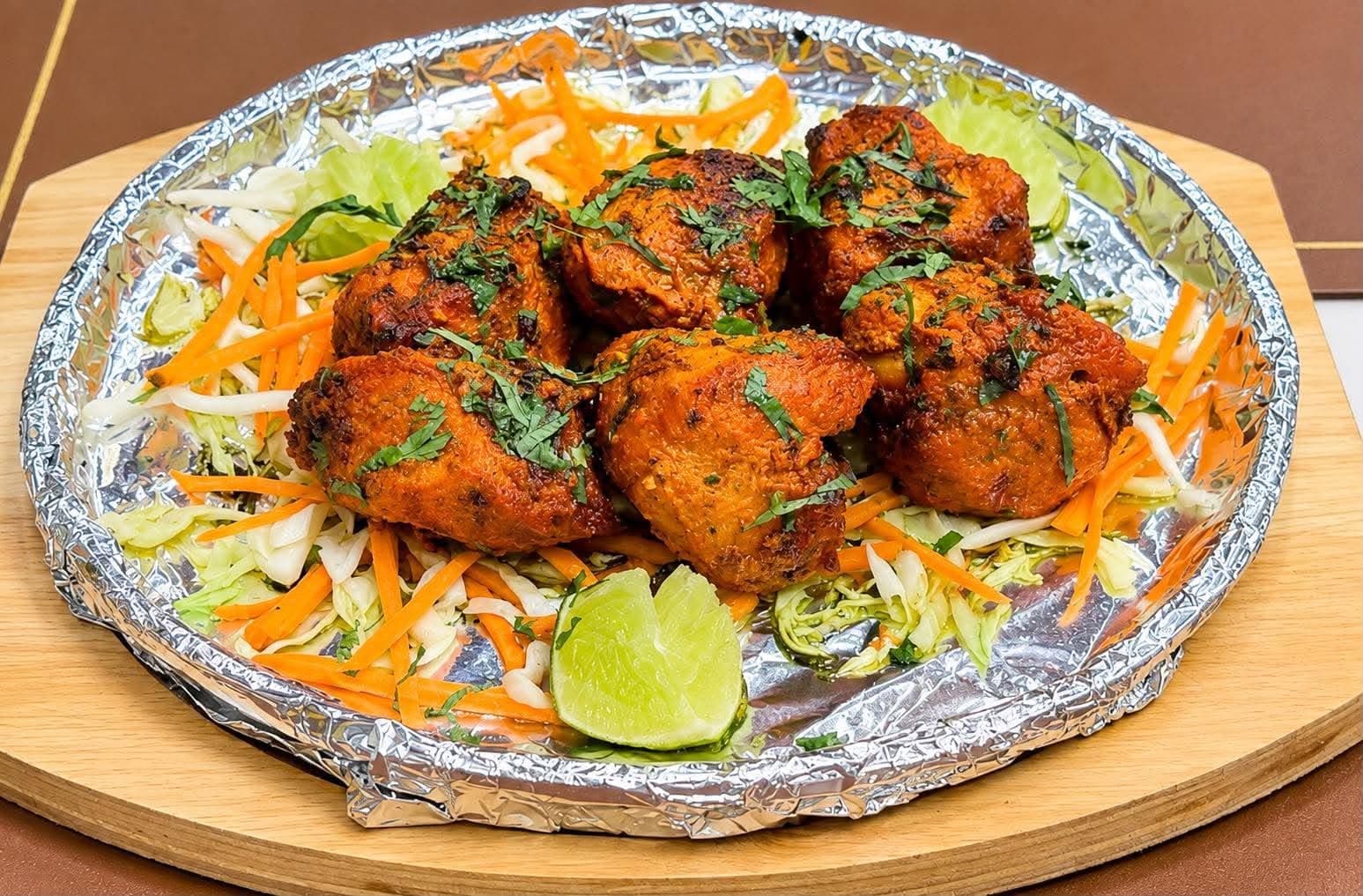Chicken Tikka — Boneless chicken pieces marinated in yogurt and spices, barbequed in the clay tandoor oven.