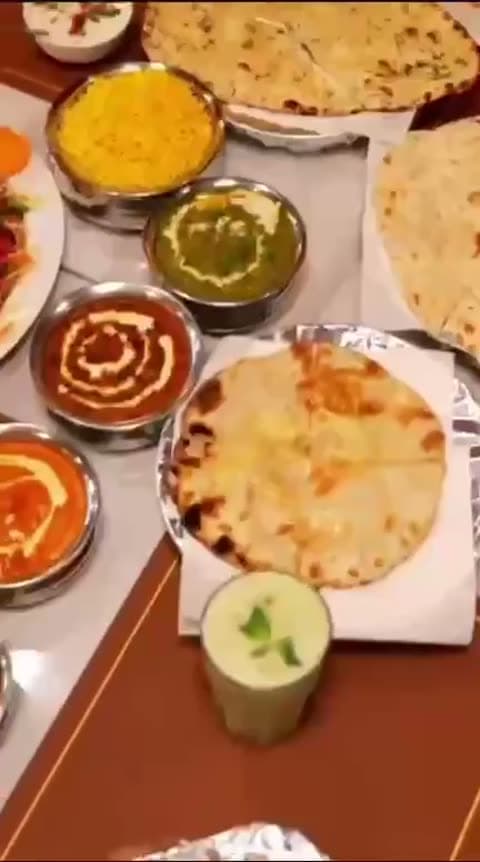 Full table tour — naan, mango lassi, pani puri, and curries